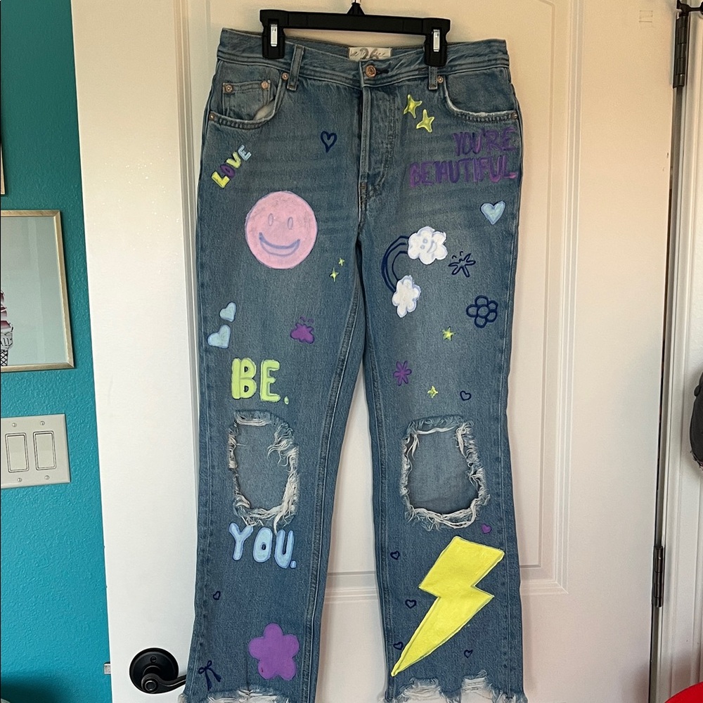 We The Free Blue Jeans with Colorful Graphics